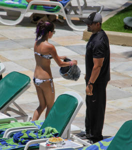 th 800522372 Celebutopia netSelenaGomez27 122 536lo Selena Gomez gets a Brazilian tan while at a pool at her hotel in Rio 2 4 12 x36